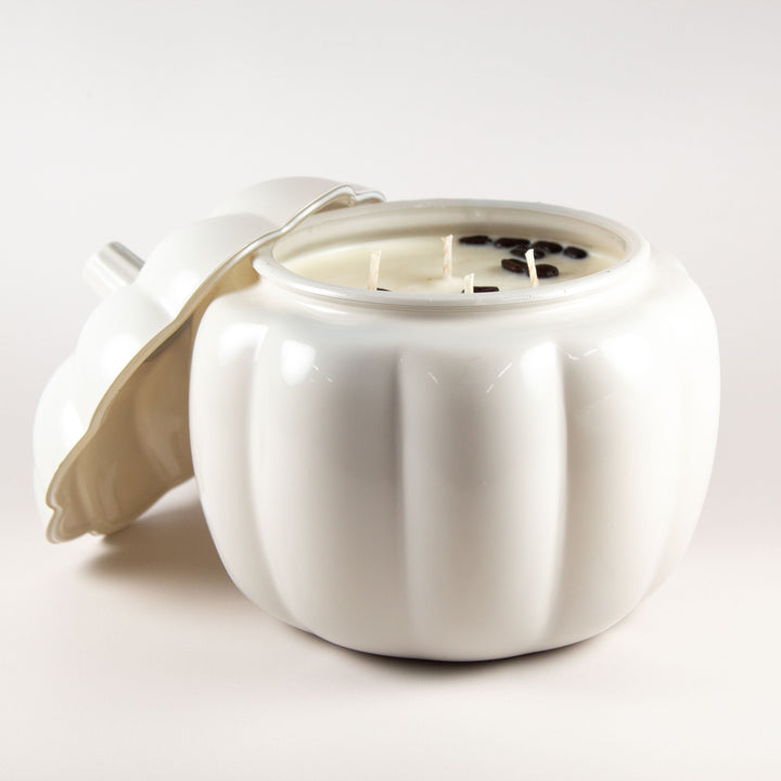 gray glass pumpkin vessel with a soy candle inside