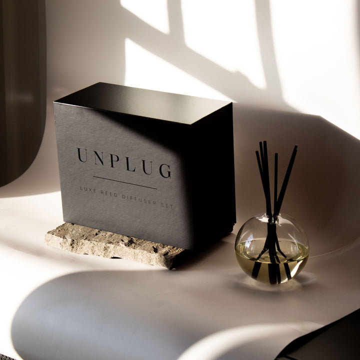 Luxe reed diffuser with elegant black packaging